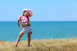 girl in a hat on the sea