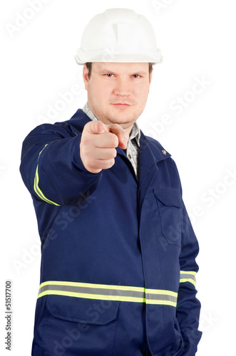 Photo: Portrait of young engineer pointing to the camera Portrait of young engineer pointing to the camera