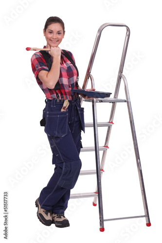 Photo: Woman painting a room red Woman painting a room red