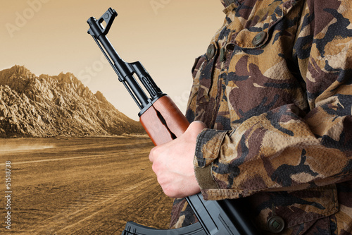 Photo: Soldier holding rifle AK-47 Soldier holding rifle AK-47
