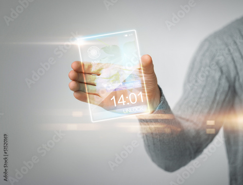 Photo: man holding transparent phone man holding transparent phone