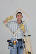 Photo: woodworker holding a window frame woodworker holding a window frame