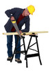 Tradesman sawing a plank