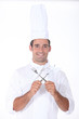 Chef with crossed cutlery