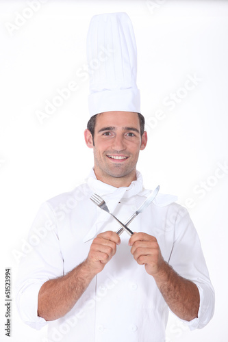 Photo: Chef with crossed cutlery Chef with crossed cutlery