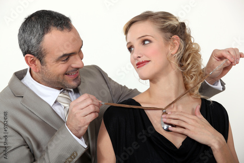 Photo: Man offering his wife a gift Man offering his wife a gift