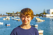 handsome happy smiling boy with the famous charco de San Gines i