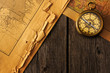 Antique compass over old map