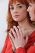 Redhead looking in a mirror