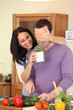 Photo: Couple preparing meal at home Couple preparing meal at home