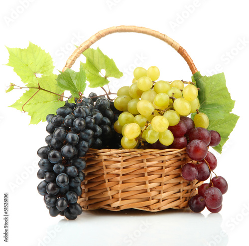 Photo: assortment of ripe sweet grapes in basket, isolated on white. assortment of ripe sweet grapes in basket, isolated on white.