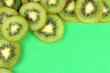 Kiwi slices frame on color background