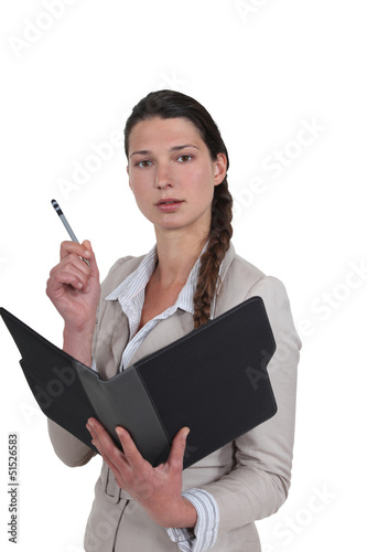 Photo: secretary holding an agenda secretary holding an agenda