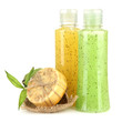 Bottles with scrub and hand-made soap, isolated on white