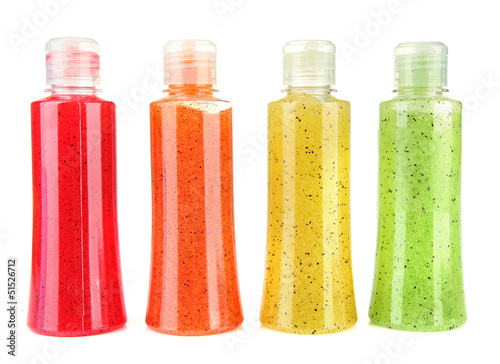 Photo: Bottles with scrub isolated on white Bottles with scrub isolated on white