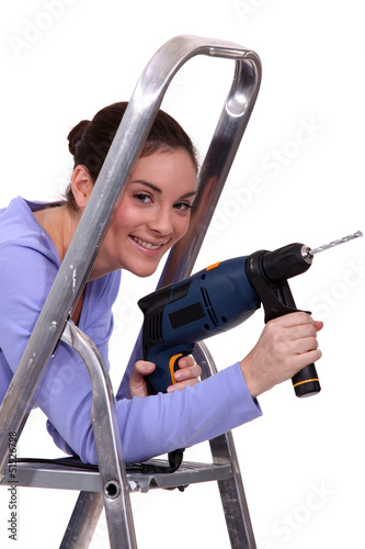 Photo: Woman with drill Woman with drill