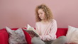 Young woman reading book