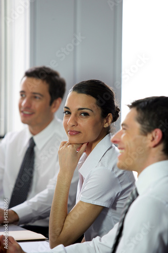 Photo: Woman participating in a business meeting Woman participating in a business meeting