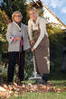 Photo: Young woman helping a senior with her garden Young woman helping a senior with her garden