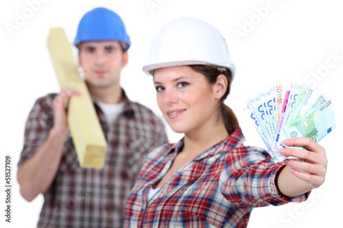 Photo: Two carpenters making money Two carpenters making money
