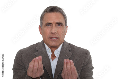 Photo: A mature businessman disagreeing. A mature businessman disagreeing.