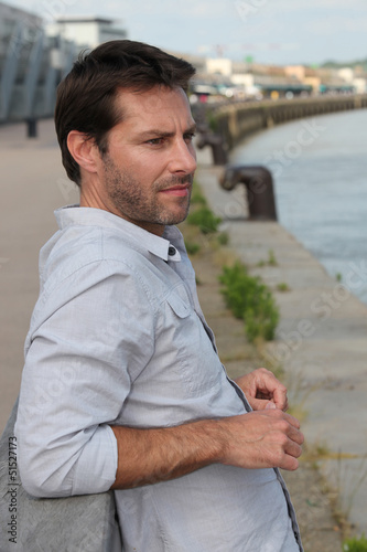 Photo: Man looking at river Man looking at river