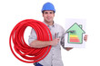 plumber holding a faucet and an energy consumption label