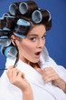 woman with curlers wearing sunglasses