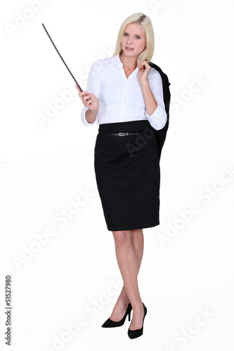 Photo: Businesswoman holding a conductor's baton Businesswoman holding a conductor's baton