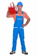 Foto: Craftsman with tool box over his shoulder Craftsman with tool box over his shoulder