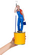 Decorator standing on paint pot