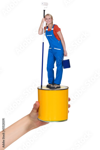 Photo: Decorator standing on paint pot Decorator standing on paint pot