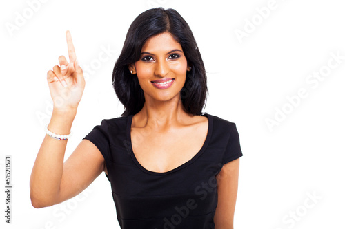 Photo: happy indian woman pointing up happy indian woman pointing up