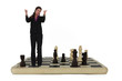 Businesswoman standing on chess board