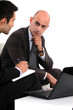 Two businessmen waiting for client