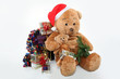 Photo: Huge teddy bear and Christmas gifts on white background Huge teddy bear and Christmas gifts on white background
