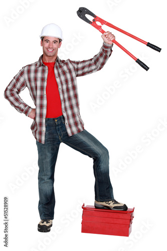 Photo: construction worker showing bolt cutters construction worker showing bolt cutters