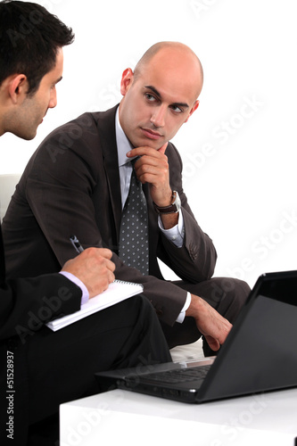 Photo: Two businessmen waiting for client Two businessmen waiting for client