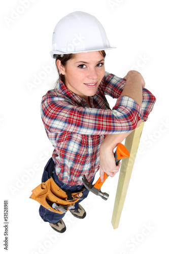Photo: High-angle shot of a female construction worker High-angle shot of a female construction worker