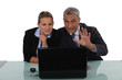 Workers in front of computer