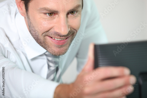 Photo: Man adjusting screen Man adjusting screen