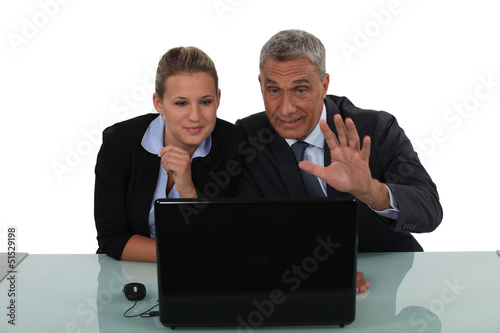 Photo: Workers in front of computer Workers in front of computer