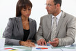 Photo: businessman displaying pie chart businessman displaying pie chart