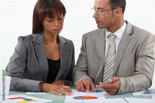 Photo: businessman displaying pie chart businessman displaying pie chart