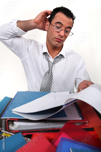Photo: An overwhelmed businessman. An overwhelmed businessman.