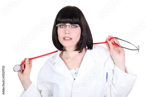 Photo: Female doctor with stethoscope on white background Female doctor with stethoscope on white background
