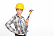 Woman holding a hammer.