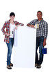 two painters holding a white ad board