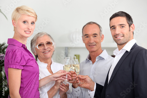 Photo: Two couples toasting with champagne Two couples toasting with champagne