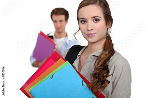 Photo: Students carrying folders Students carrying folders